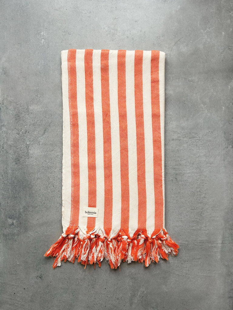 Wholesale Brighton Stripe cotton hammam towel with bold orange summer stripe and finished with fringe