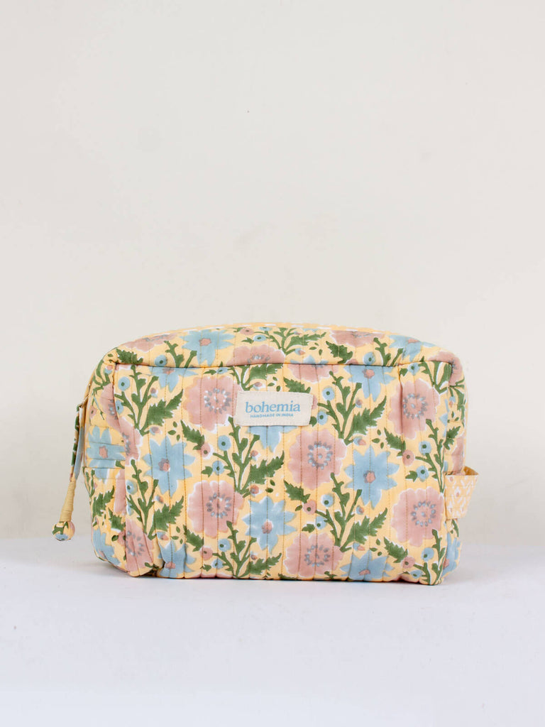 Large hand block print, cotton-quilted wash bags in buttermilk yellow