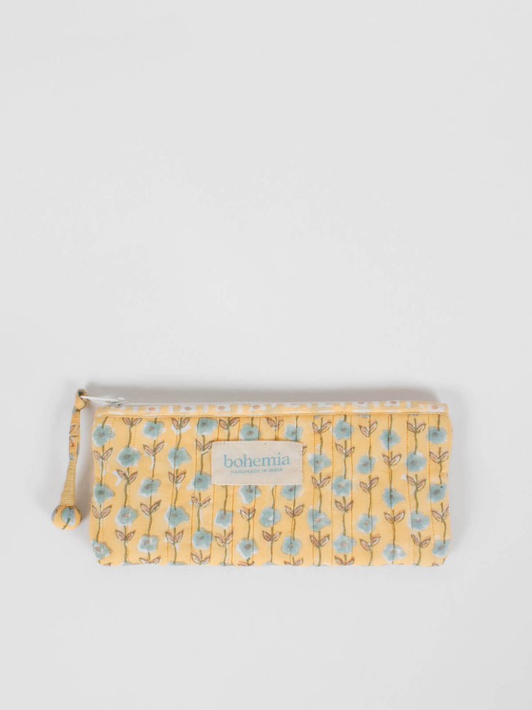 Long quilted zip pouch with buttermilk yellow and blue block printed pattern