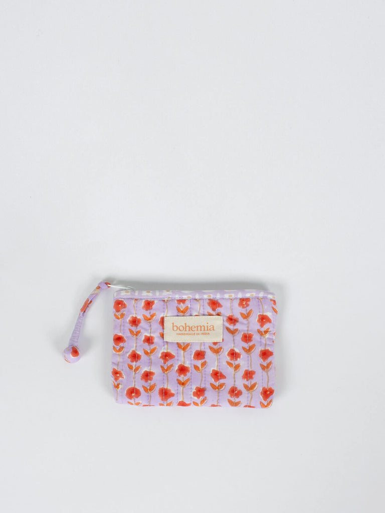 Small quilted zip pouch with lilac and orange block printed pattern