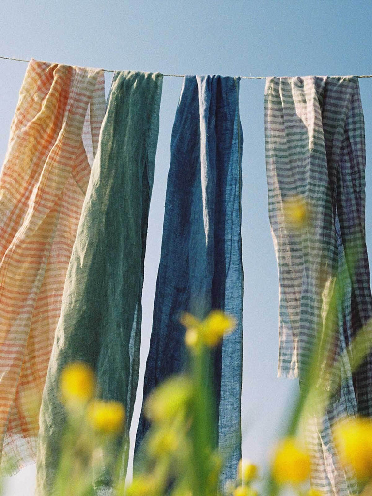 Summer linen scarves hanging together on a line