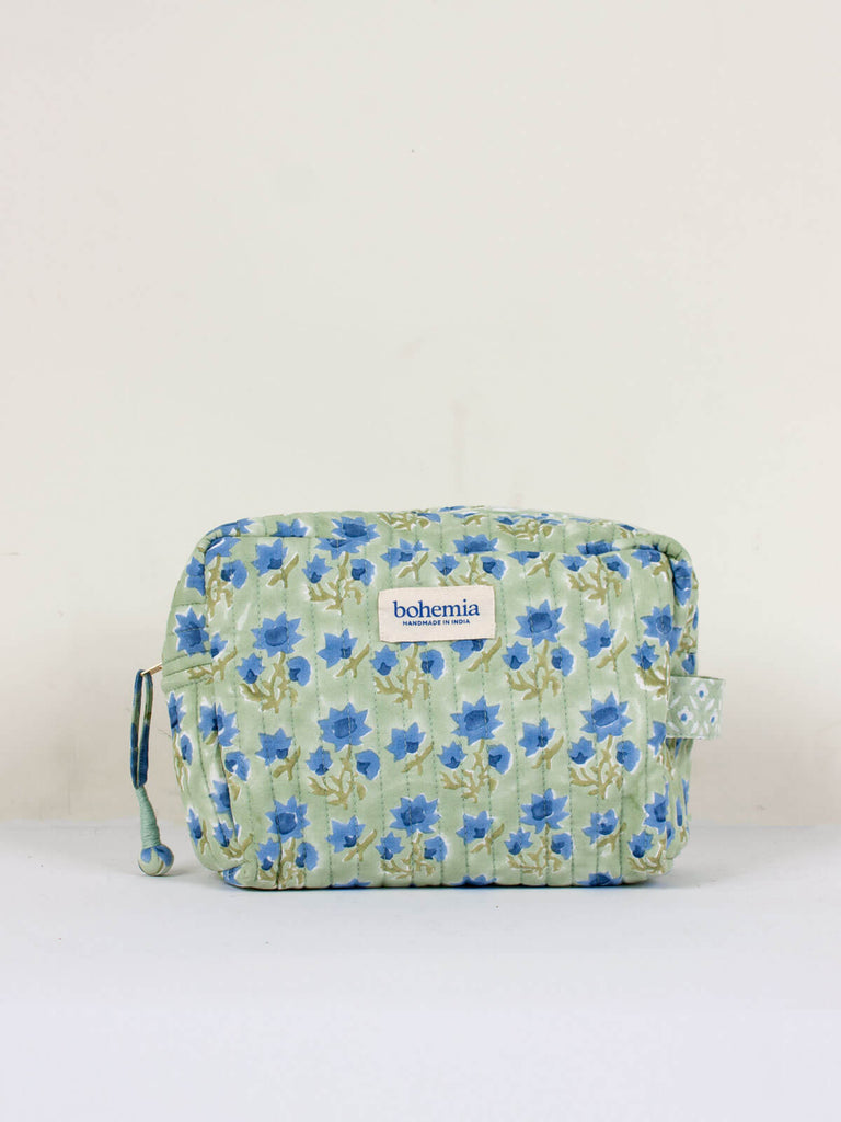 A soft sage green and blue hand block printed quilted Posie wash bag