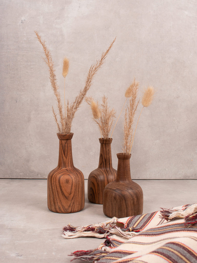 Set of three mini walnut wood vases by Bohemia Design filled with dried flowers