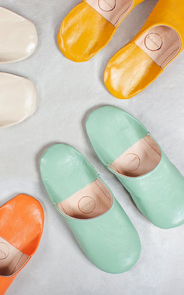 Colourful Moroccan babouche slippers by Bohemia Design on grey tiles