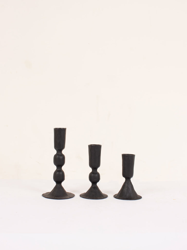 Three sizes of the black iron Austen candle holders