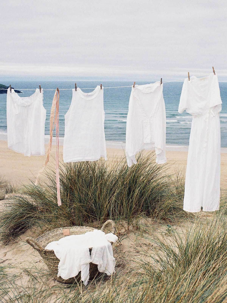 Large Beldi Basket filled with linen by a washing line on a beach