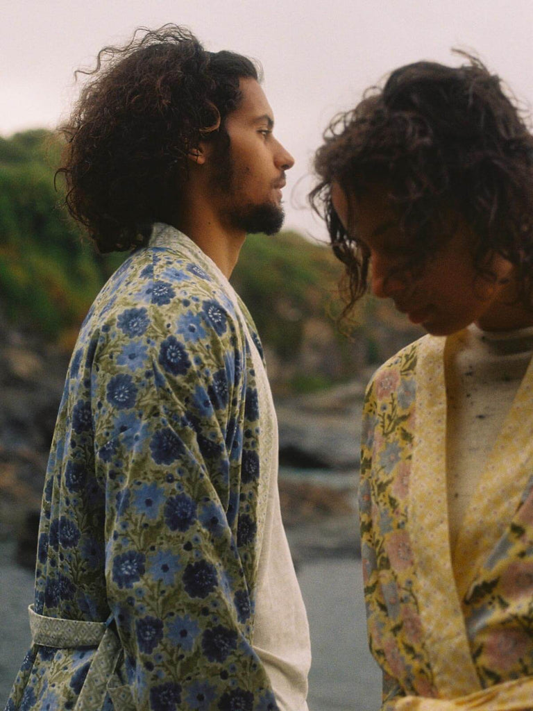 Male model by the sea wearing a Bohemia sage floral block print robe.