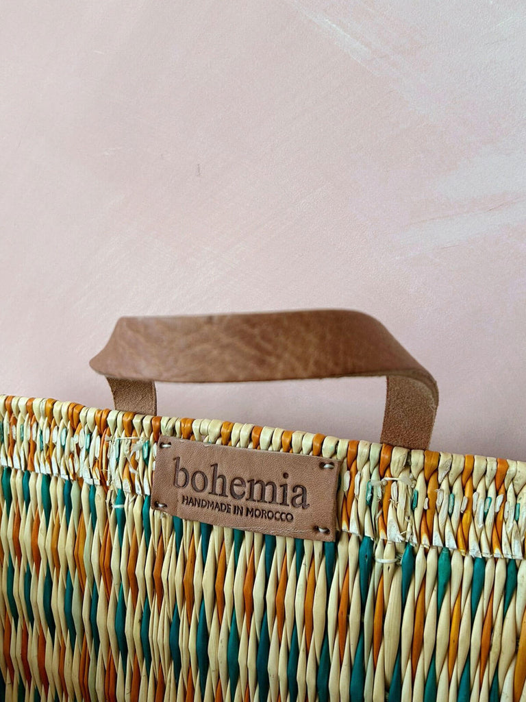 Supple leather handles and hand stampled Bohemia label on the colourful woven reed shopper basket for wholesale