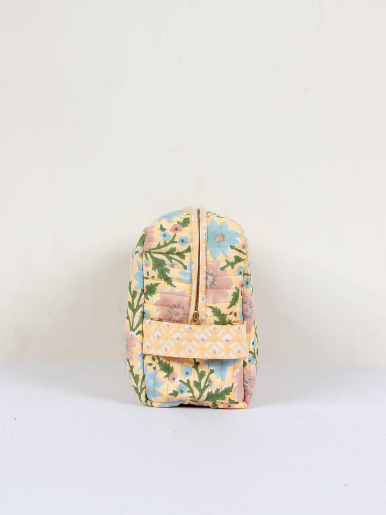 Buttermilk yellow and blue quilted Floribunda washbag with practical carry handle.