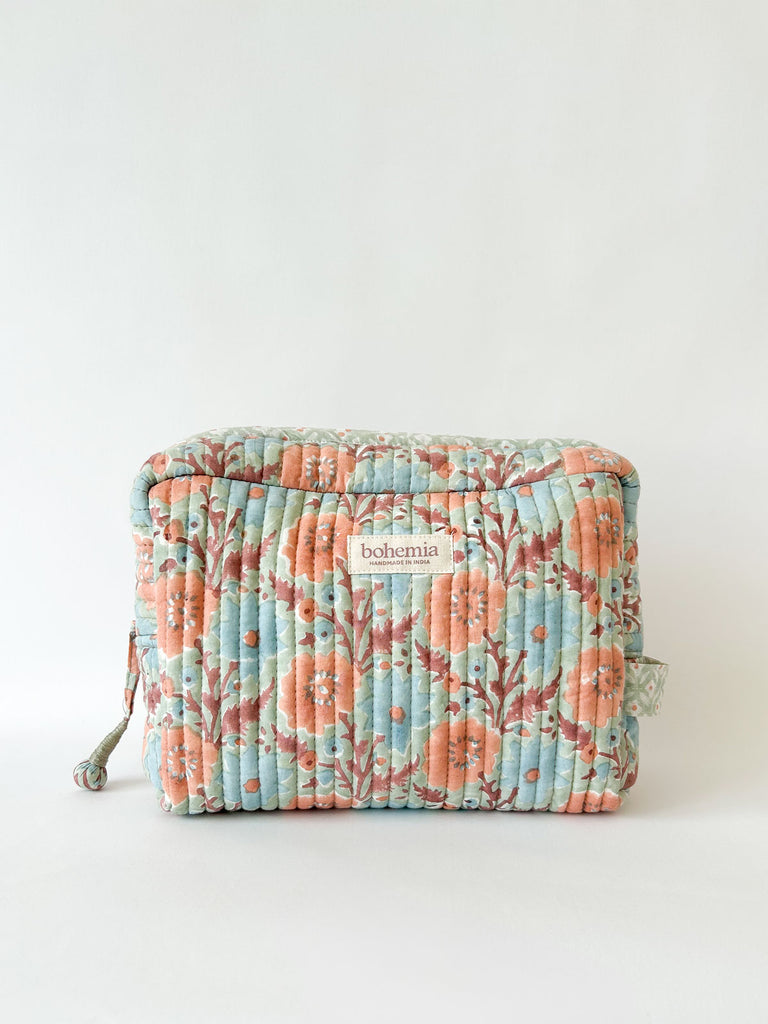 Large Floribunda cotton quilted wash bag with hand block printed floral design in soft duck egg with a hint of green, pale blue and terracotta by Bohemia Design
