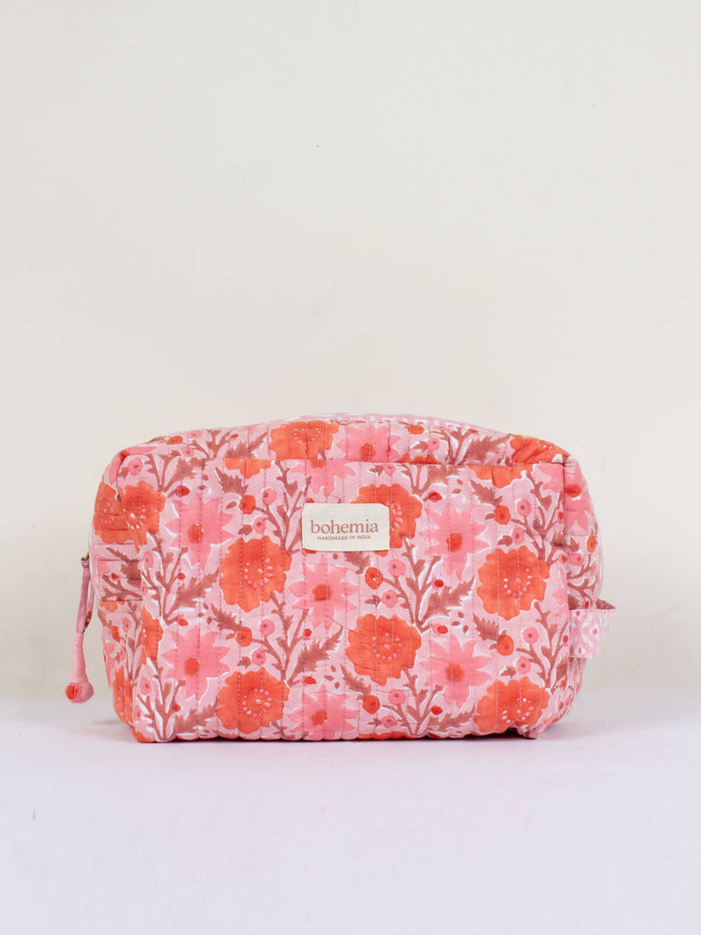 A vintage pink quilted Floribunda Washbag with floral hand block-printed pattern.