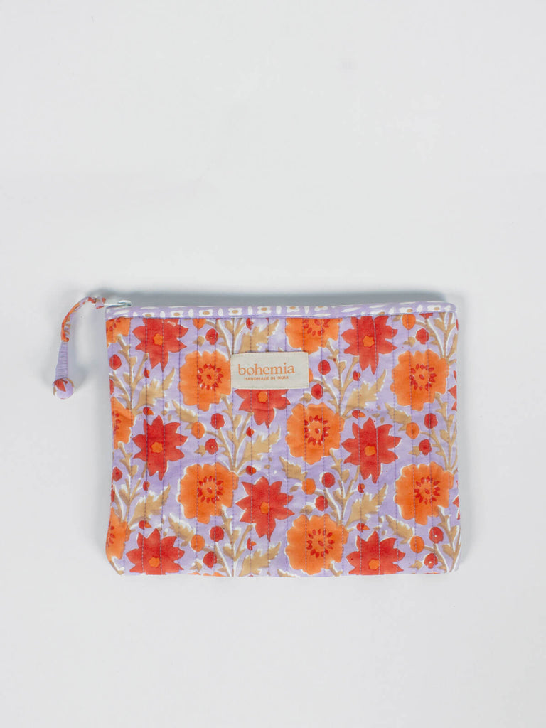 Large quilted cotton zip pouch with a block printed lilac and orange floral design