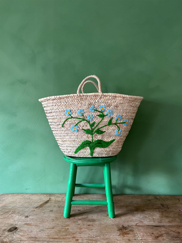 Natural handwoven market basket bag with delicate sky-blue embroidered Forget-Me-Not florets by Bohemia Design