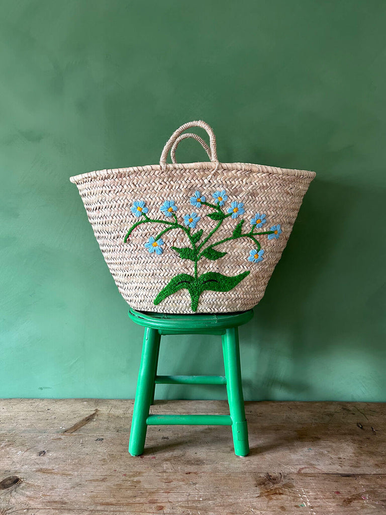 Boho natural handwoven market basket, featuring delicate sky blue embroidered Forget-Me-Not florets by Bohemia Design