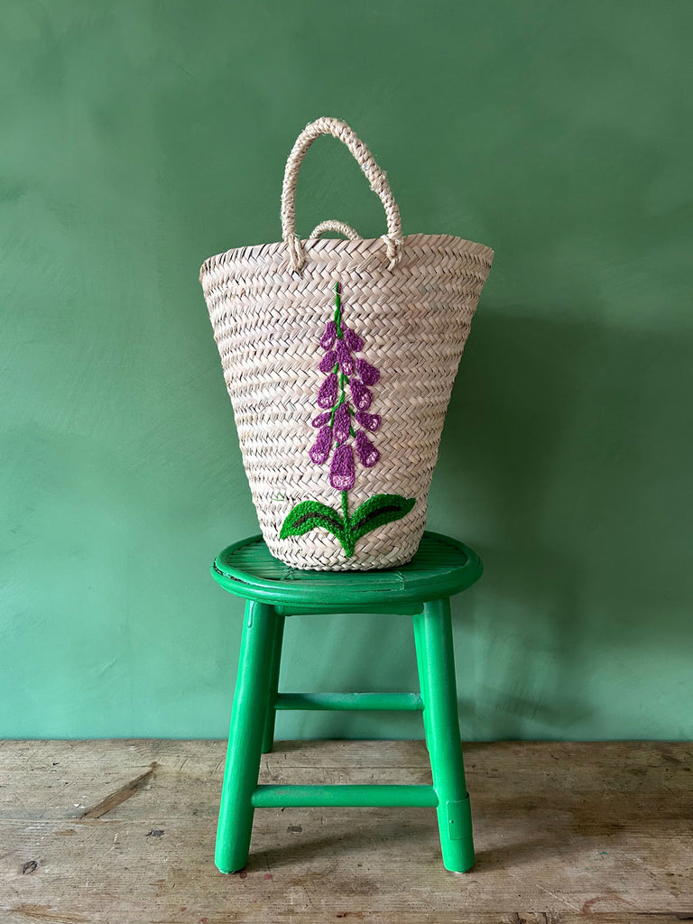 Hand-embroidered wholesale bucket basket with a Foxglove floral motif against a vibrant green backdrop by Bohemia Design | Bohemia Design