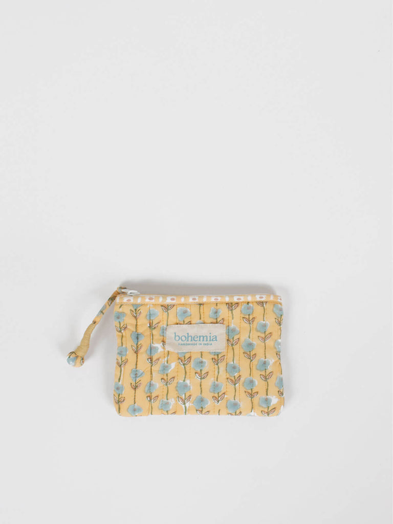 Small quilted zip pouch with buttermilk yellow and blue block printed pattern