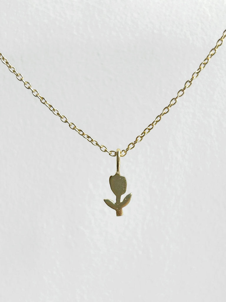 Tiny gold tulip necklace on a fine gold chain for wholesale