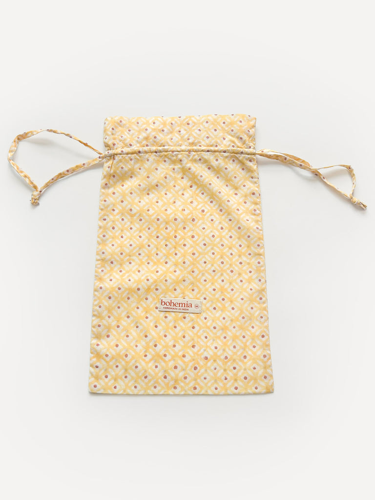 Cotton voile drawstring bag in Buttermilk yellow with Bohemia small label on the front.