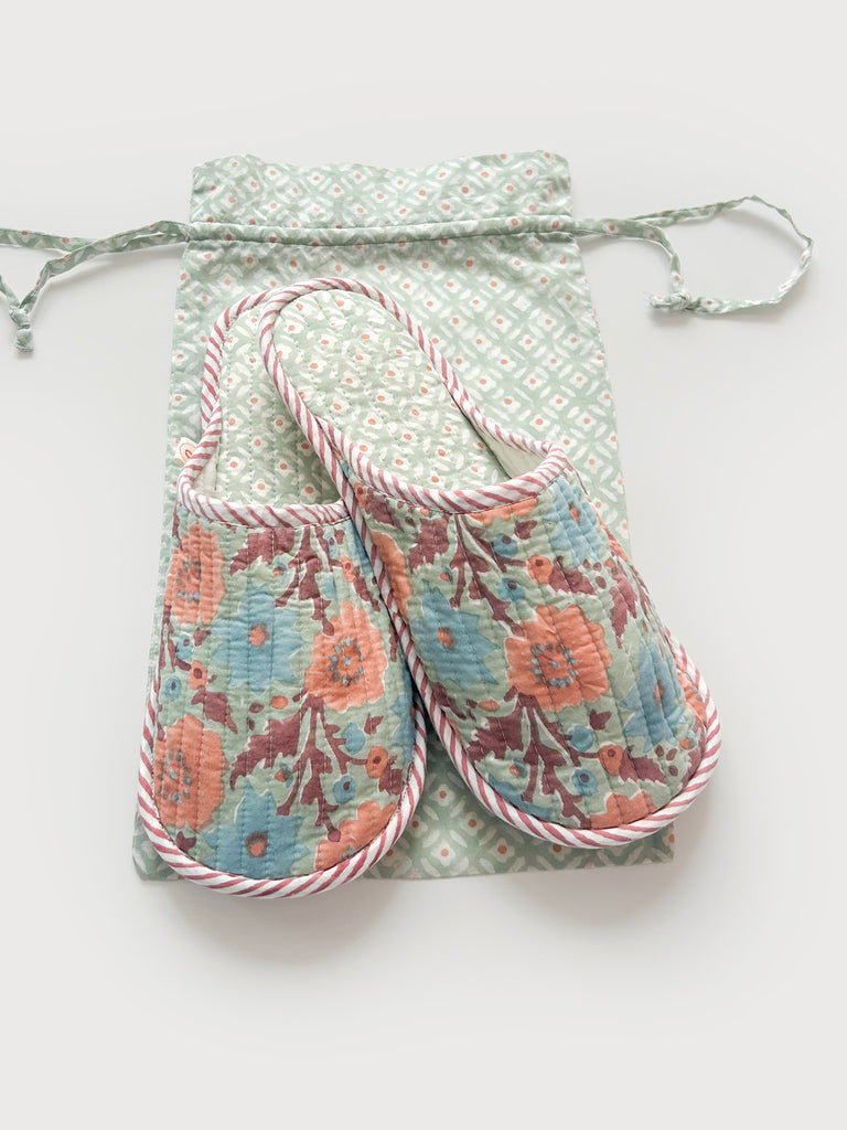 A pair of floral block print house slippers with a lining in a contrasting Ditsy print and a matching cotton voile drawstring bag - ideal for travel | Bohemia Design