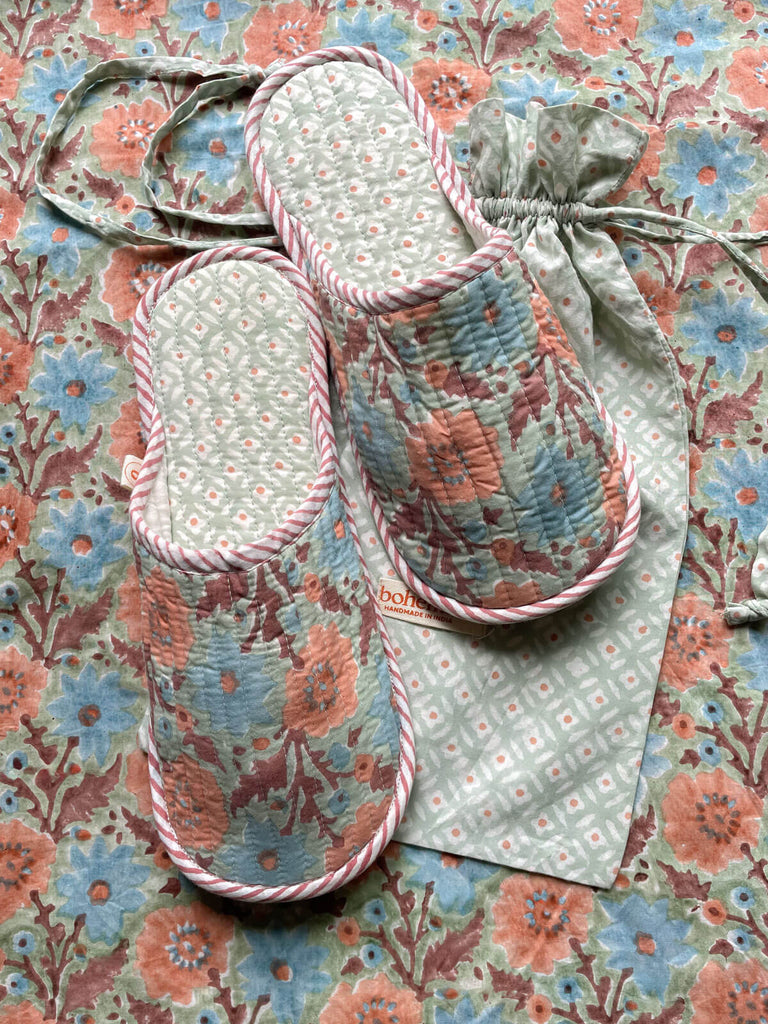 Soft, lightweight Floribunda pattern house slippers with a ditsy print drawstring bag on a matching floral background, Duck Egg | Bohemia Design