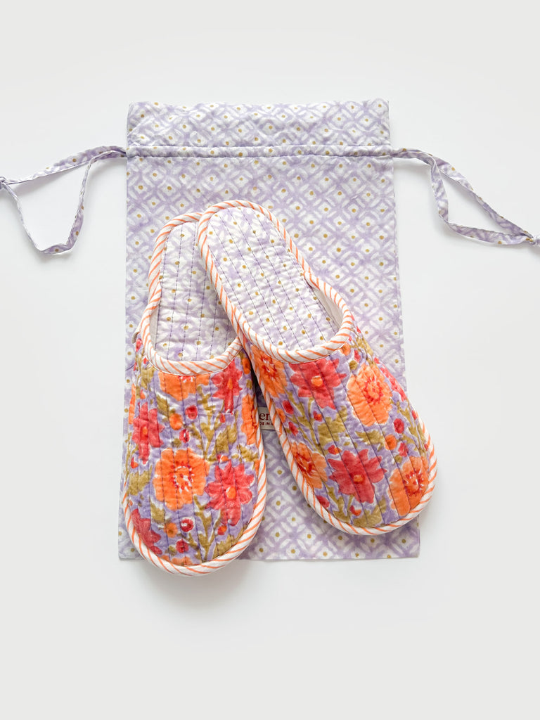 A pair of floral print house slippers with a contrasting ditsy print lining and a matching cotton voile drawstring bag - perfect for travel | Bohemia Design