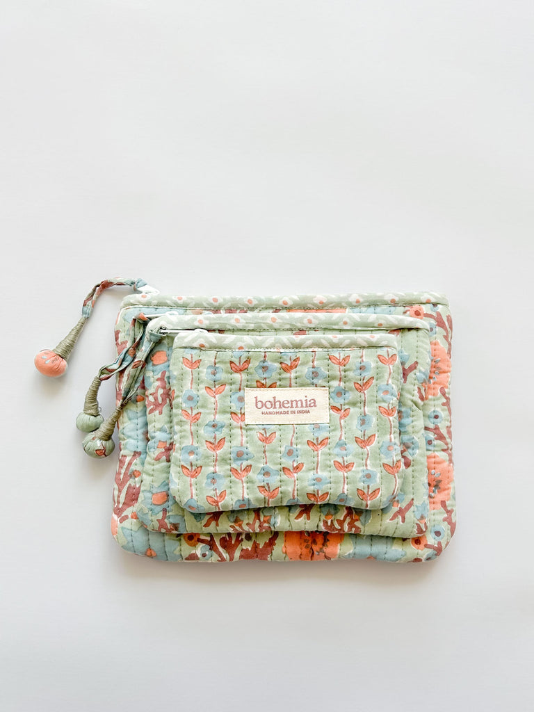 Set of 3 zip pouches with blue and terracotta flowers hand block printed on a soft green cotton base by Bohemia Design