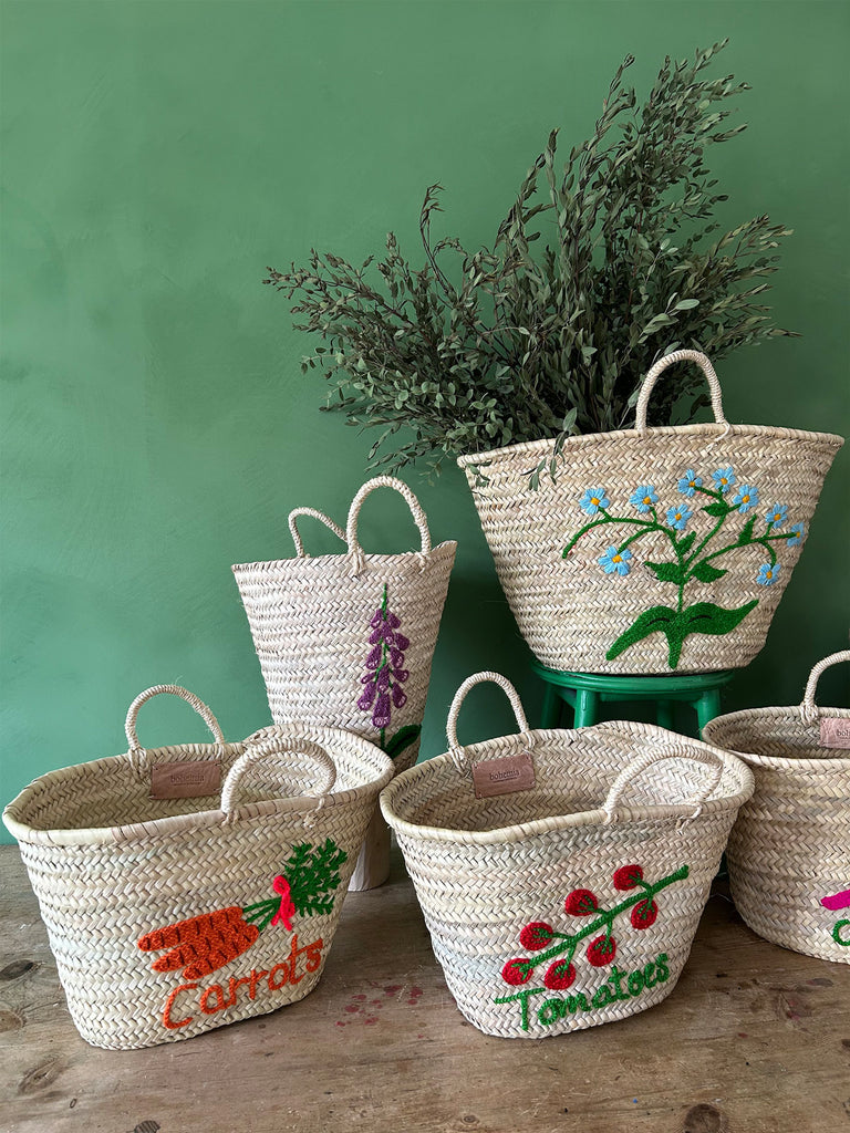 Collection of hand embroidered basket bags in various shapes, sizes and designs by Bohemia Design