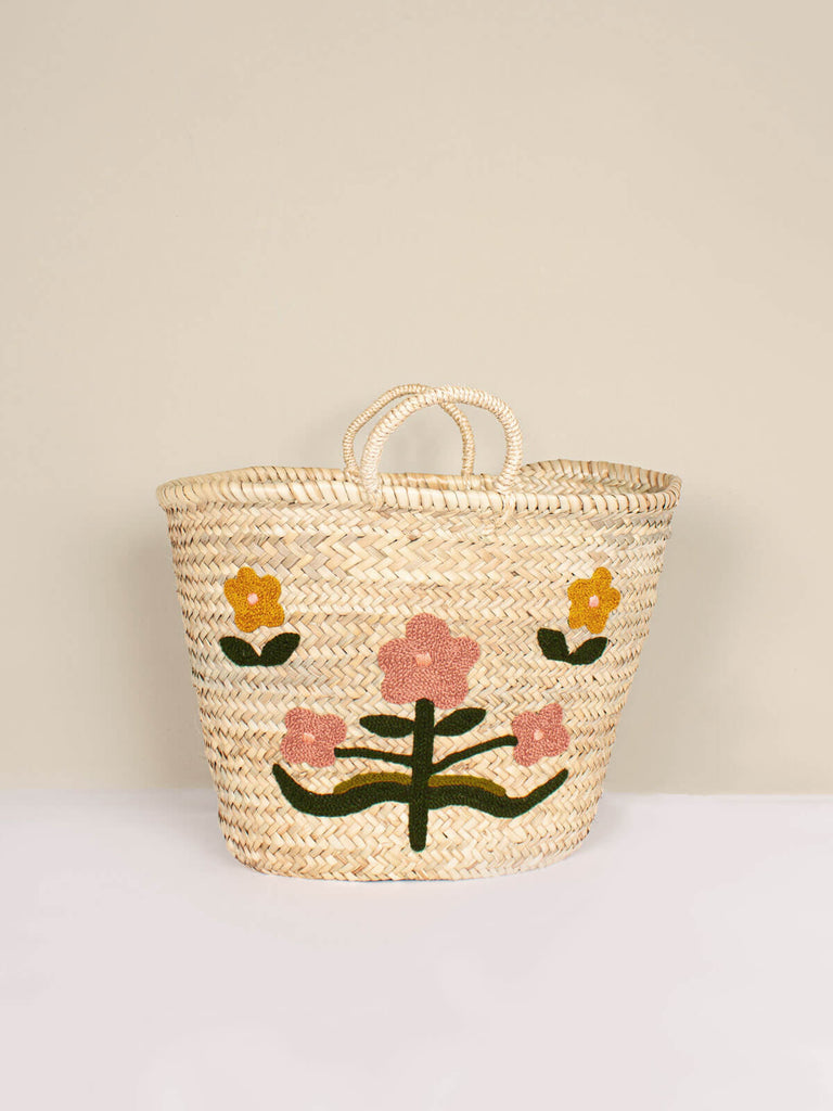 Market basket with two short handles featuring folk art inspired floral embroidery