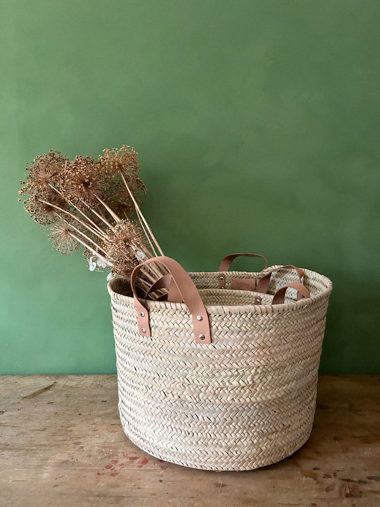 Nest of leather handle storage baskets made form palm leaf
