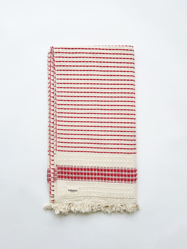Milos Check Hammam Towel in terracotta with waffle textured weave.
