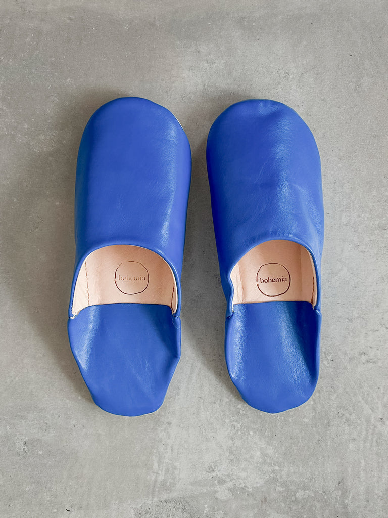 Men's Moroccan leather slippers in deep Majorelle blue on a grey background | Bohemia