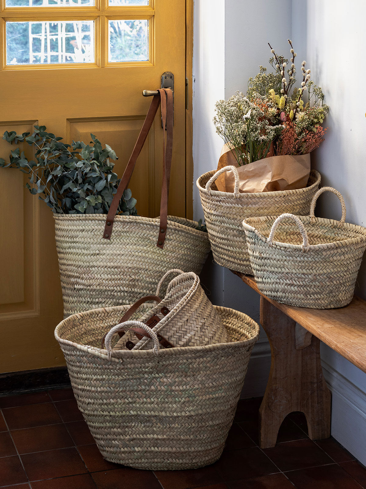 Natural woven market baskets in a hallway