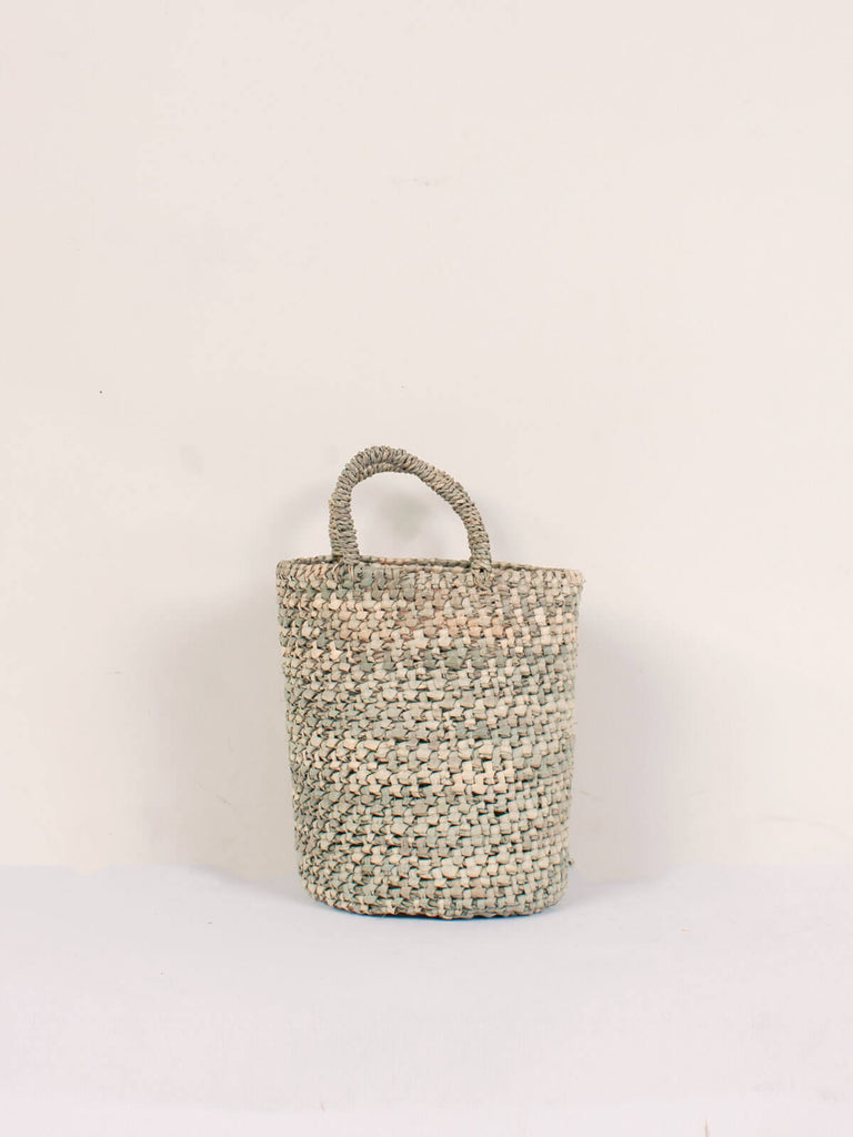 Small round open weave nesting basket with short handles
