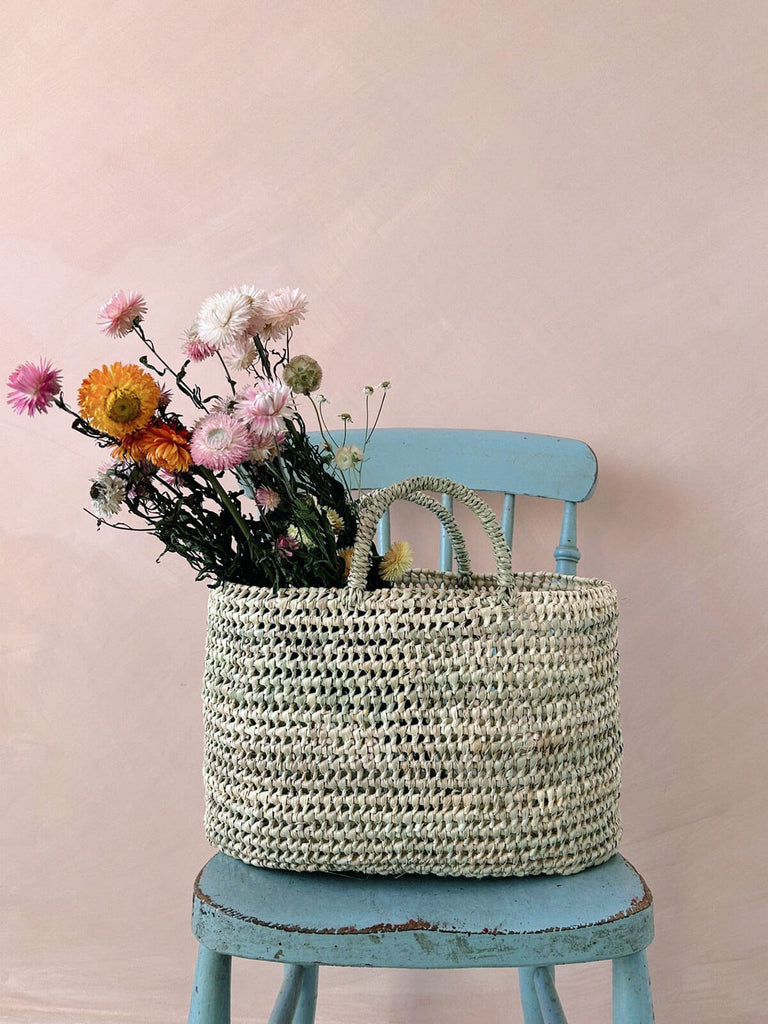 Oval open weave nesting basket bag with dried flowers
