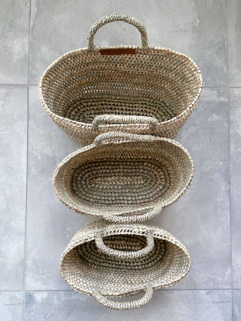Set of three wholesale open weave nesting storage or shopping baskets woven from natural fibres