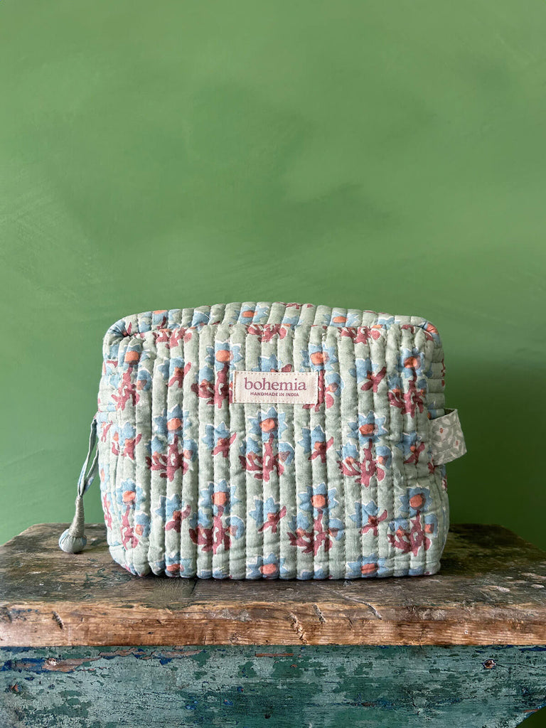 Posie, a medium size cotton quilted washbag with soft duck egg floral block print pattern by Bohemia