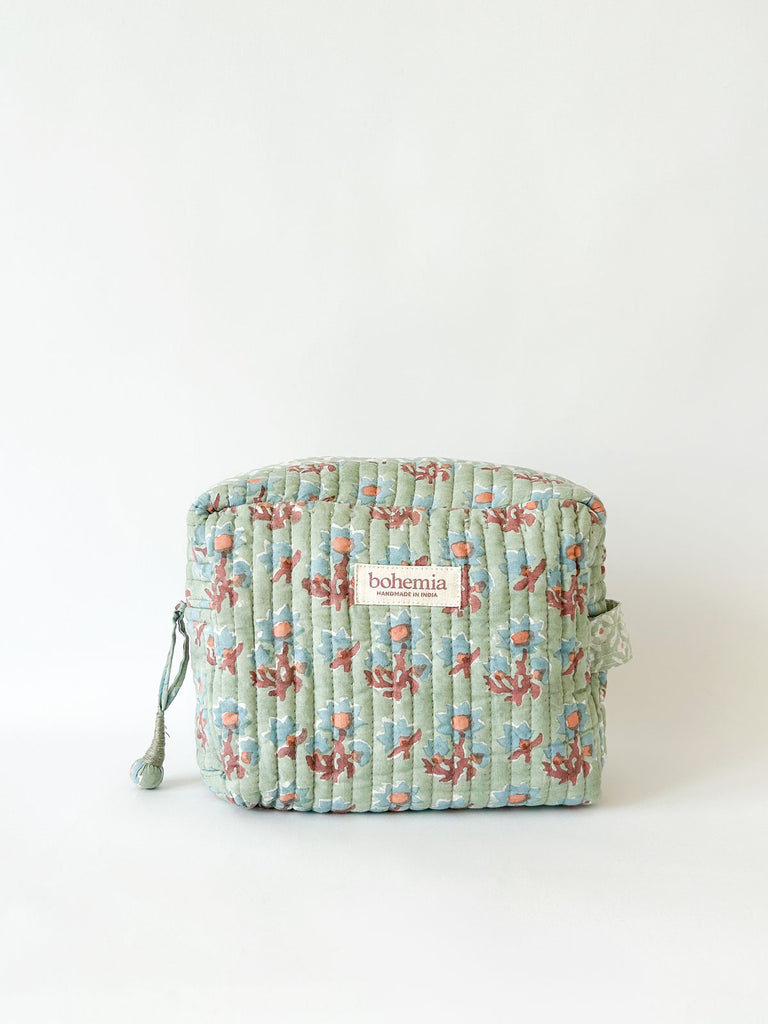 Posie hand block printed, quilted cotton washbag in soft green with delicate blue and terracotta floral pattern by Bohemia