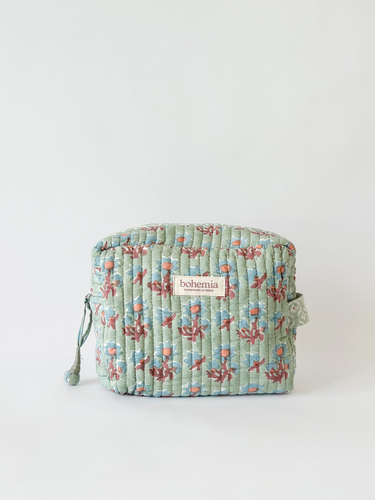 Posie hand block printed, quilted cotton washbag in soft green with delicate blue and terracotta floral pattern by Bohemia