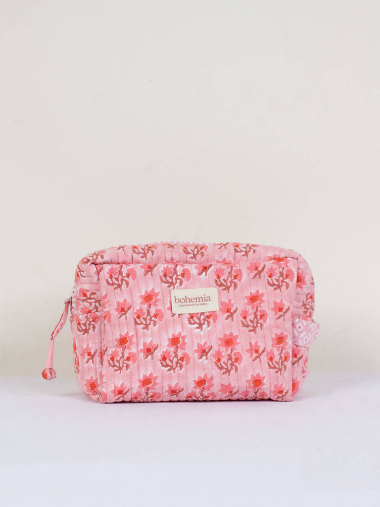 A vintage pink hand block printed quilted Posie wash bag