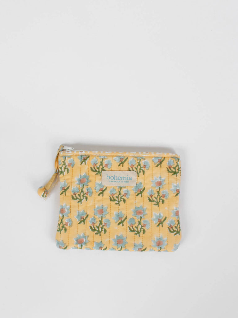 Medium quilted zip pouch with buttermilk yellow and blue floral block printed pattern