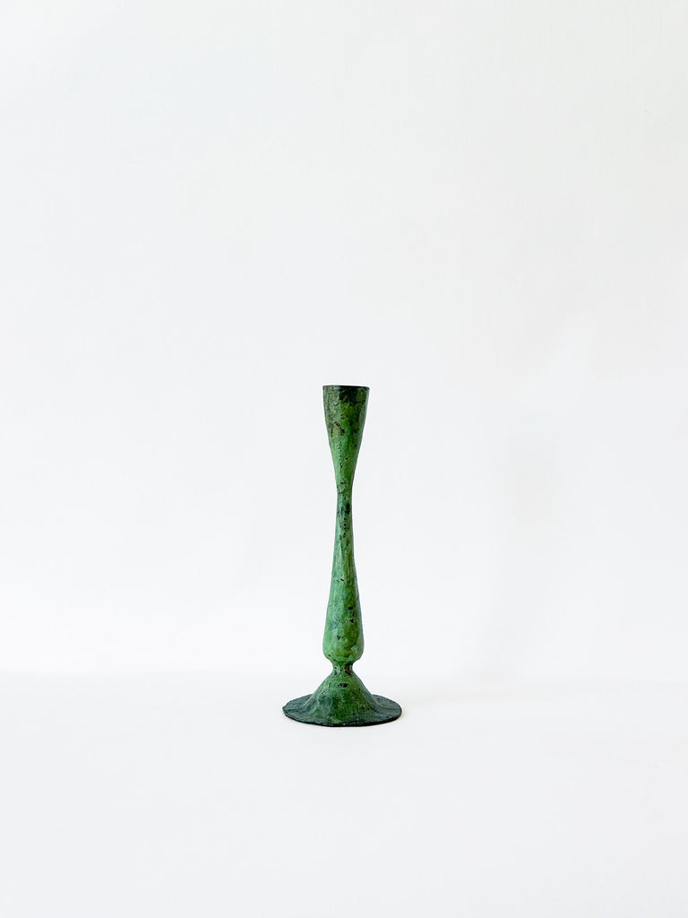 Small antique iron candle holder in verdigris patina finish on a white background by Bohemia
