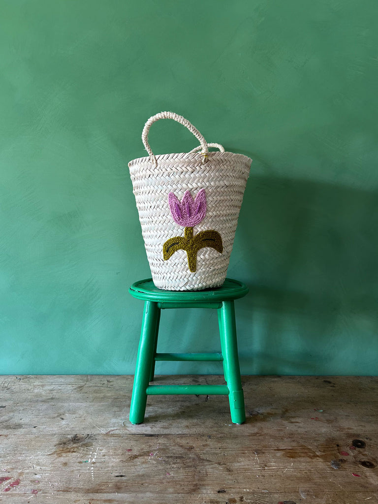 Hand embroidered bucket basket with a Tulip motif on a green background | Bohemia Design