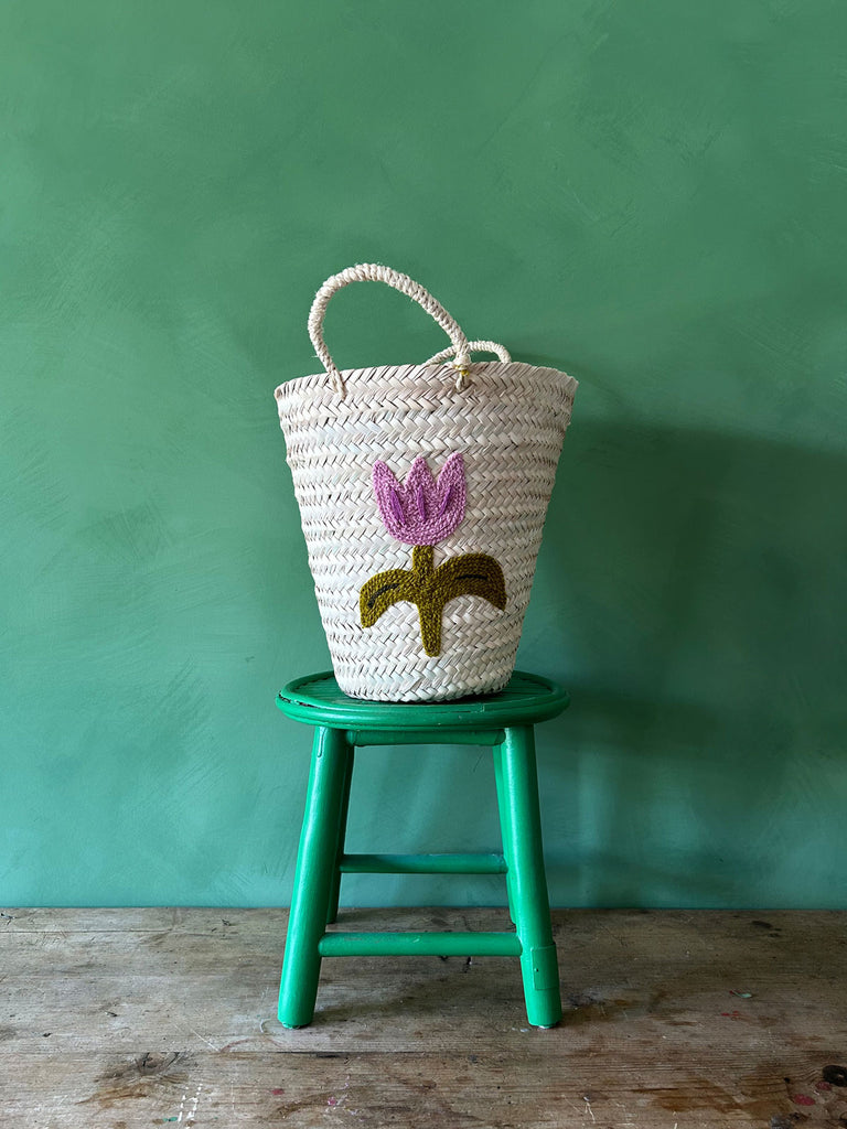 Hand embroidered bucket basket with a Tulip motif on a green background | Bohemia Design