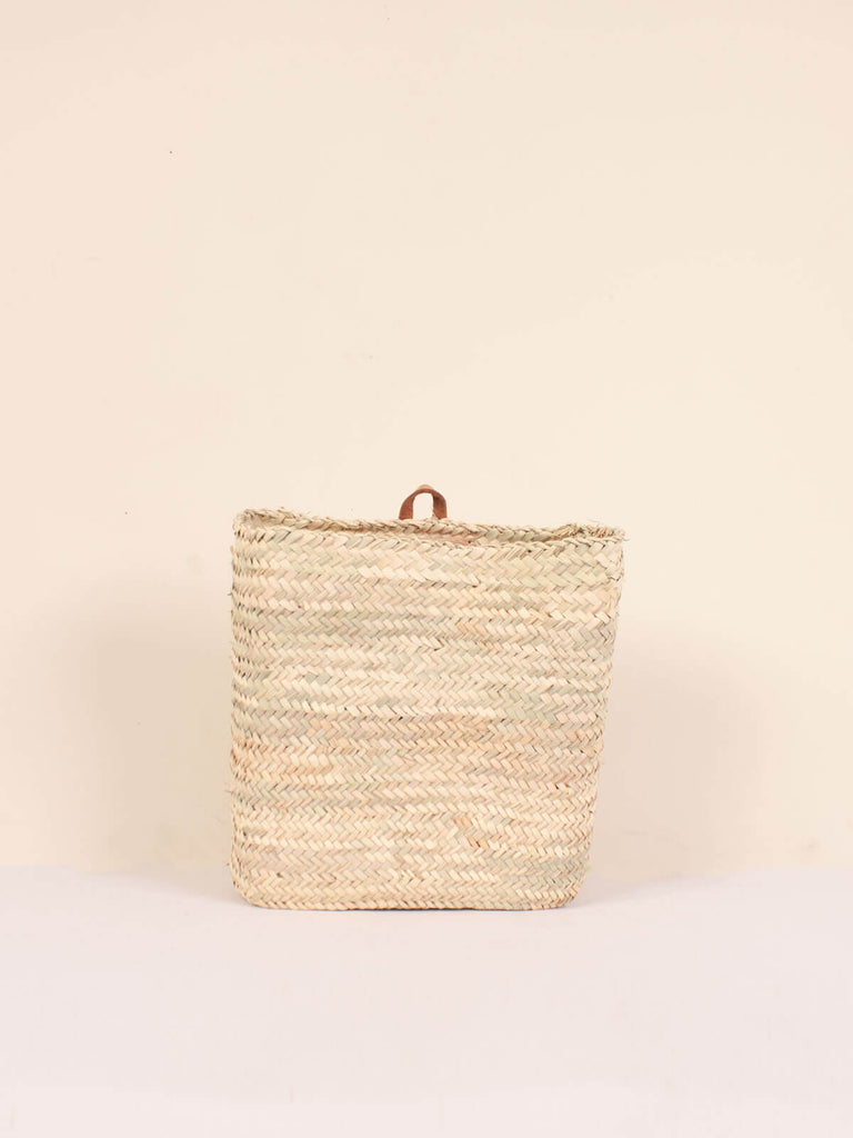 Medium natural woven rectangular wall basket with small leather loop