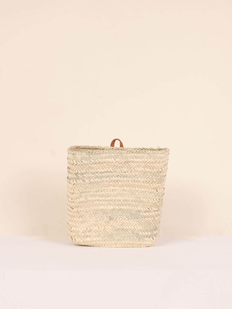 Small natural woven rectangular wall basket with small leather loop