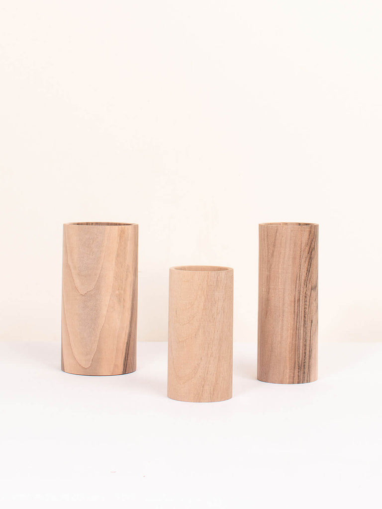 Three handcrafted walnut wood vases for dried flower displays