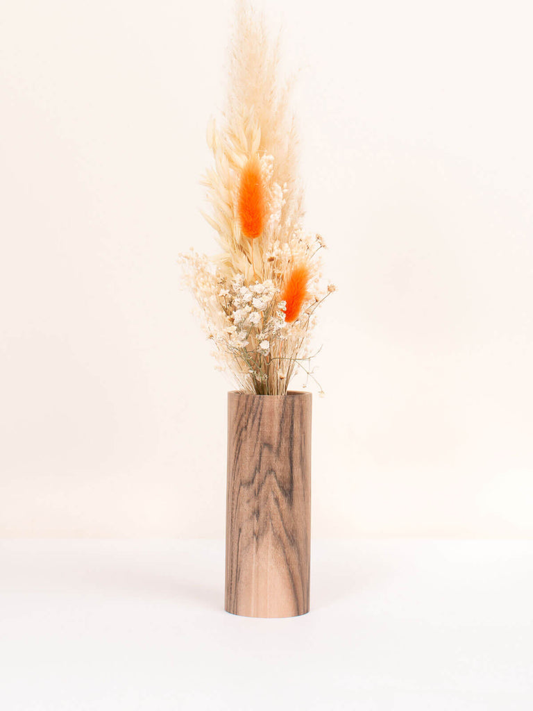 Medium walnut wood vase with a posy of orange dried flowers