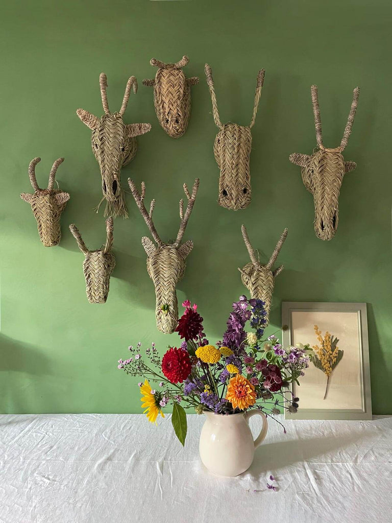 Group of wholesale wall mounted woven animal heads.