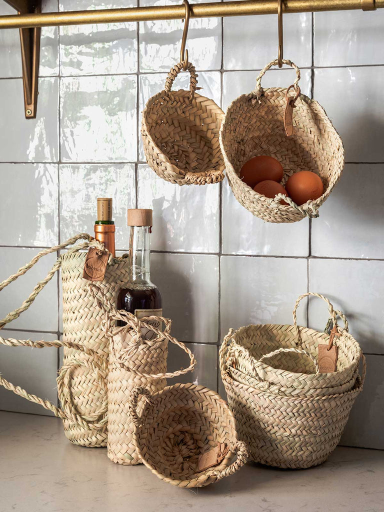 Tiny baskets and hanging baskets in kitchen