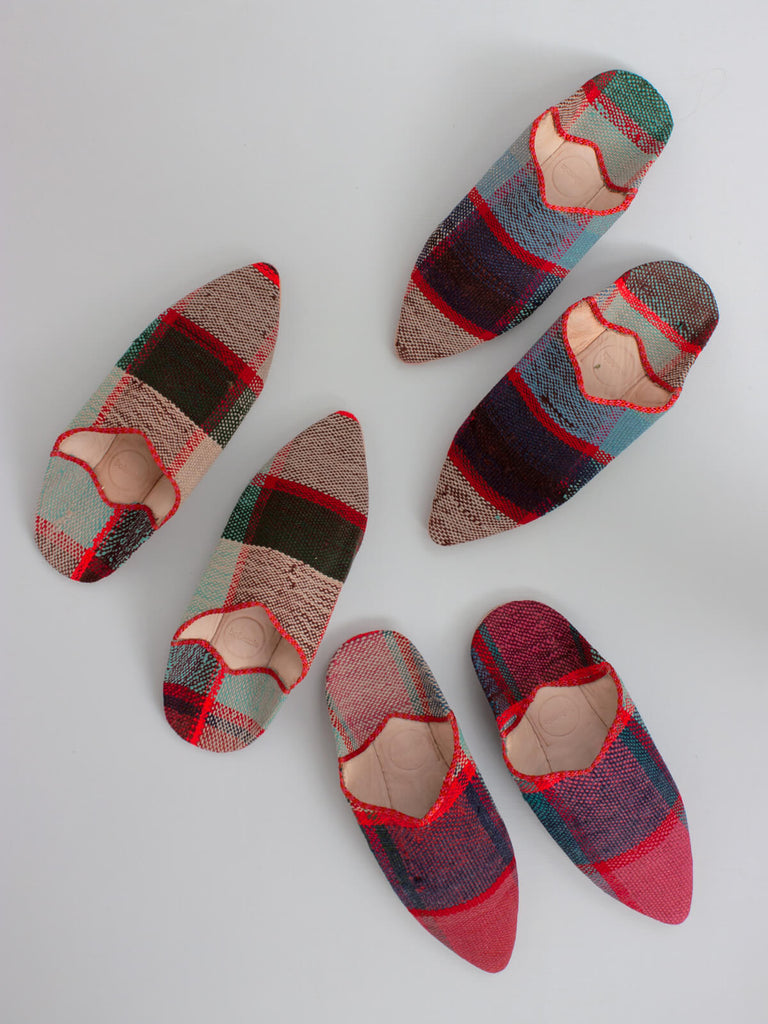 Group of three pairs of Limited edition Moroccan boujad pointed leather and textile babouche slippers with a red, pink and teal check pattern.